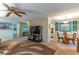 Open living space with a dining area and a large TV at 151 E Plantation Blvd, Lake Mary, FL 32746