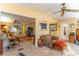 Spacious living room with multiple seating areas and views into other rooms at 151 E Plantation Blvd, Lake Mary, FL 32746