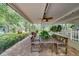 Relaxing covered patio with seating and a dining table at 151 E Plantation Blvd, Lake Mary, FL 32746