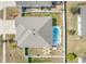 Bird's eye view of a house with pool and backyard oasis at 15267 Aquarius Way, Mascotte, FL 34753