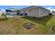 Spacious backyard with pool, landscaping, and a small garden at 15267 Aquarius Way, Mascotte, FL 34753