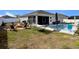Private backyard with pool, hammock, and fire pit at 15267 Aquarius Way, Mascotte, FL 34753