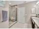 Modern bathroom with a glass shower and mosaic tile at 15267 Aquarius Way, Mascotte, FL 34753