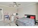 Bright bedroom featuring a comfortable bed and workspace at 15267 Aquarius Way, Mascotte, FL 34753