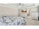 Spacious bedroom with a large bed and plenty of closet space at 15267 Aquarius Way, Mascotte, FL 34753