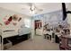 Charming bedroom with a whimsical cloud and butterfly wall mural at 15267 Aquarius Way, Mascotte, FL 34753