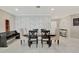 Elegant dining room with a table, bench and chairs at 15267 Aquarius Way, Mascotte, FL 34753