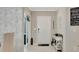 Inviting entryway showcasing decorative wall and storage console at 15267 Aquarius Way, Mascotte, FL 34753