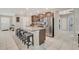 Modern kitchen with stainless steel appliances and island at 15267 Aquarius Way, Mascotte, FL 34753