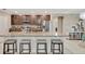 Modern kitchen featuring granite island and breakfast bar at 15267 Aquarius Way, Mascotte, FL 34753