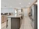 Spacious kitchen with granite countertops and stainless steel appliances at 15267 Aquarius Way, Mascotte, FL 34753