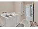 Laundry room with washer, dryer, and access to bathroom at 15267 Aquarius Way, Mascotte, FL 34753