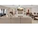 Bright and airy living room with fireplace and built-in shelving at 15267 Aquarius Way, Mascotte, FL 34753