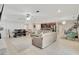 Spacious living room with comfortable seating and open floor plan at 15267 Aquarius Way, Mascotte, FL 34753