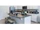 Modern kitchen with stainless steel appliances and granite counters at 1529 Isleta Loop, Kissimmee, FL 34741