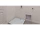 Simple laundry room with a built-in utility sink at 1529 Isleta Loop, Kissimmee, FL 34741