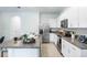 Modern kitchen with granite countertops and stainless steel appliances at 1533 Isleta Loop, Kissimmee, FL 34741