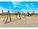 Wooden swing set and playground equipment in a community park at 1533 Isleta Loop, Kissimmee, FL 34741