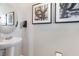 Powder room with pedestal sink and modern decor at 1537 Isleta Loop, Kissimmee, FL 34741