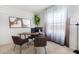 Bright home office features a large window, wood desk, and comfortable leather chairs at 1537 Isleta Loop, Kissimmee, FL 34741