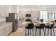 Modern kitchen with island, granite countertops, and stainless steel appliances at 1537 Isleta Loop, Kissimmee, FL 34741