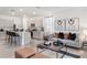 Open concept living room with contemporary furniture and sliding glass doors to backyard at 1537 Isleta Loop, Kissimmee, FL 34741