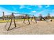 Wooden swing set in community playground at 1537 Isleta Loop, Kissimmee, FL 34741