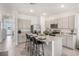 Modern kitchen with island seating and granite countertops at 1541 Isleta Loop, Kissimmee, FL 34741