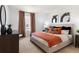 Spacious main bedroom with plush bed and orange accents at 1547 Isleta Loop, Kissimmee, FL 34741