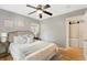 Serene bedroom with hardwood floors, neutral color scheme, and comfortable queen-sized bed at 1825 Park Lake St, Orlando, FL 32803