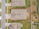 Aerial view of a home with a fenced backyard, landscaping, and its position on the block at 1882 Rustic Falls Dr, Kissimmee, FL 34744