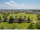 Aerial view of the community park area, featuring a playground, green spaces, and walking paths at 1882 Rustic Falls Dr, Kissimmee, FL 34744