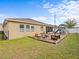Spacious backyard with a patio, playground, and well-manicured lawn at 1882 Rustic Falls Dr, Kissimmee, FL 34744