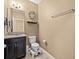 Cozy bathroom featuring a granite-topped vanity and tile flooring at 1882 Rustic Falls Dr, Kissimmee, FL 34744