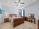 Bedroom with a dresser, bedside table, carpet flooring, and overhead fan at 1882 Rustic Falls Dr, Kissimmee, FL 34744