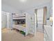 Bedroom with bunk beds and storage drawers, carpet, and natural light at 1882 Rustic Falls Dr, Kissimmee, FL 34744