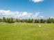 Large community park with a playground, soccer goals, and ample green space for outdoor activities and community events at 1882 Rustic Falls Dr, Kissimmee, FL 34744