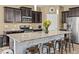 Kitchen island featuring granite countertops, modern appliances, and stylish cabinetry at 1882 Rustic Falls Dr, Kissimmee, FL 34744