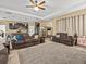 Open-concept living room featuring comfortable seating and seamless flow into the kitchen at 1882 Rustic Falls Dr, Kissimmee, FL 34744