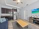 Open floor plan kitchen and living room area with updated appliances and natural light at 1882 Rustic Falls Dr, Kissimmee, FL 34744