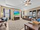Comfortable living room featuring cozy seating, neutral tones, and a large television at 1882 Rustic Falls Dr, Kissimmee, FL 34744