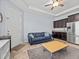 Open living room featuring a couch, ceiling fan, and coffee table at 1882 Rustic Falls Dr, Kissimmee, FL 34744