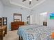 Cozy bedroom with a king bed and hardwood furnishings at 1882 Rustic Falls Dr, Kissimmee, FL 34744