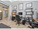 Bright office space featuring a large desk and storage shelves with natural light at 1882 Rustic Falls Dr, Kissimmee, FL 34744