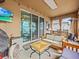 Relaxing outdoor patio with comfortable seating and entertainment at 1882 Rustic Falls Dr, Kissimmee, FL 34744