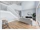 Living room with light gray walls and a comfy gray couch at 211 Amesbury Ln, Kissimmee, FL 34758