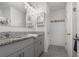 Bathroom vanity with double sinks and granite countertop at 213 Caryota Ct, New Smyrna Beach, FL 32168