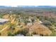 Aerial view of property with paddocks and pond at 2140 W State Road 46, Geneva, FL 32732