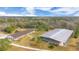 Aerial view of property with house, arena, and paddocks at 2140 W State Road 46, Geneva, FL 32732