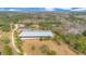 Aerial view showcasing house and riding arena at 2140 W State Road 46, Geneva, FL 32732